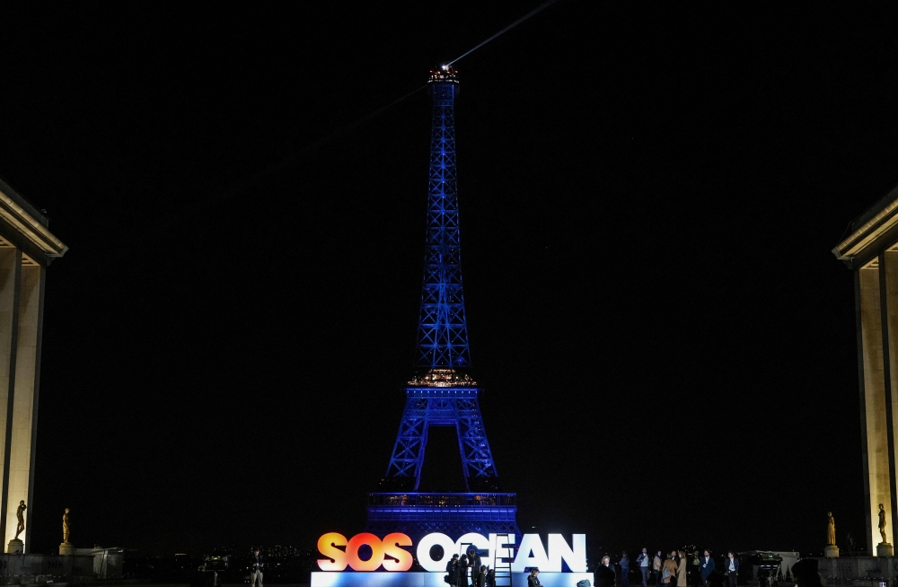 The Eiffel Tower is illuminated in the colour blue to mark the two-day international event 