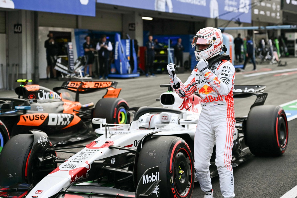Red Bull Racing's Dutch driver Max Verstappen celebrates taking pole position in the qualifying session of the Formula One Japanese Grand Prix at the Suzuka circuit in Suzuka, Mie prefecture on April 5, 2025. (Photo by MOHD RASFAN / AFP)
