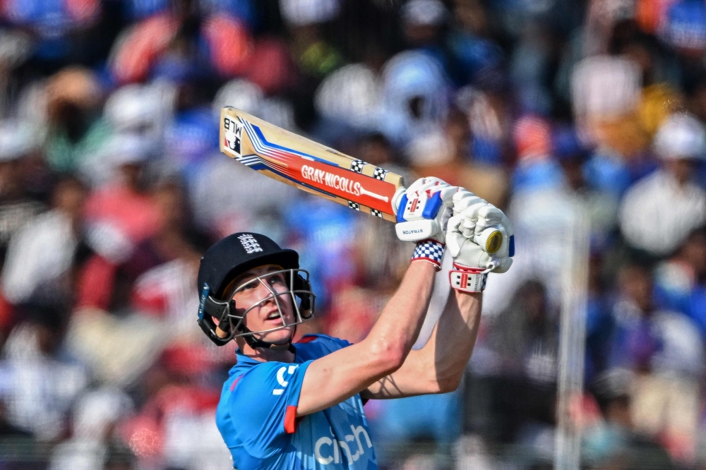 (Files) England's Harry Brook watches the ball after playing a shot during the second one-day international (ODI) cricket match between India and England at the Barabati Stadium in Cuttack on February 9, 2025. (Photo by Dibyangshu Sarkar / AFP) 