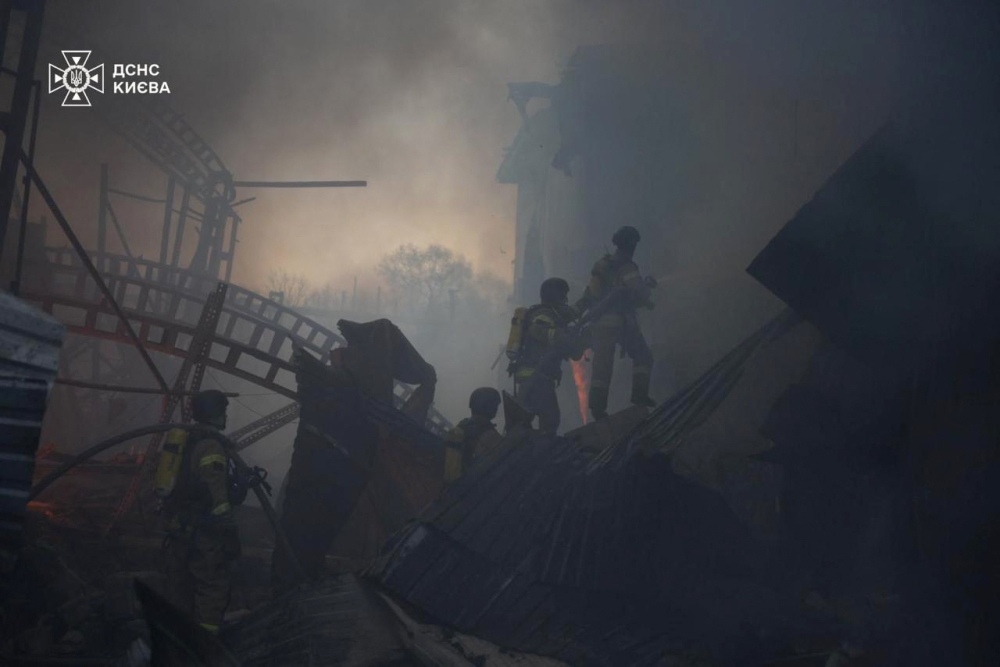 This handout photograph taken and released by the State Emergency Service of Ukraine on April 6, 2025, shows Ukrainian firefighters working on a fire following a Russian missile strike in Kyiv. (Photo by Handout / State Emergency Service of Ukraine / AFP) 