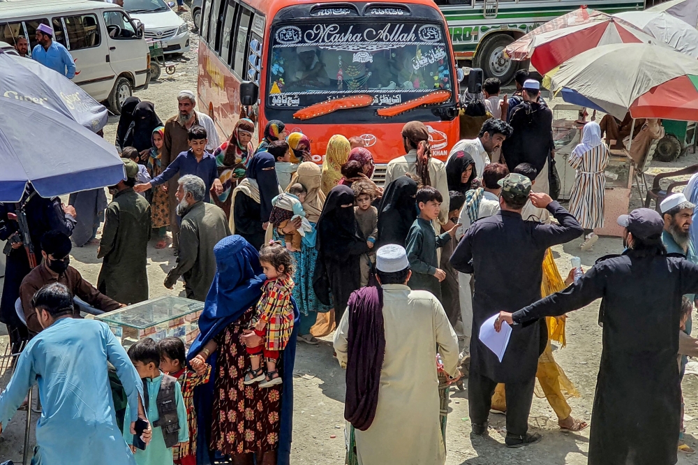 Afghan refugees arrive to undergo biometric verifications at Pakistan's National Database and Registration Authority (NADRA) ahead of their departure for Afghanistan, at a holding centre in Landi Kotal on April 7, 2025. (Photo by AFP)