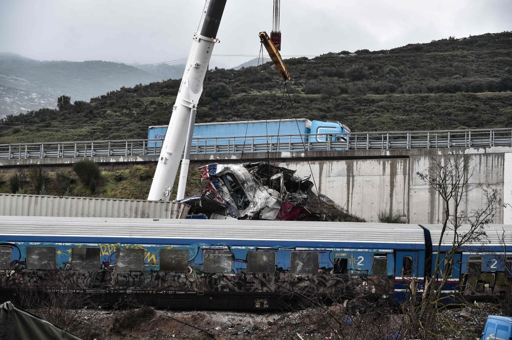 Search operations are underway after a head-on collision of a freight train with a passenger train carrying over 350 people killed dozens of people on February 28, the country's worst-ever rail disaster, in the Tempi Valley near Larissa on March 2, 2023. (Photo by Sakis MITROLIDIS / AFP)

