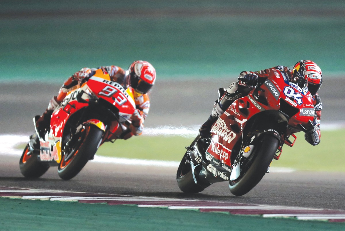 Mission Winnow Ducati’s Italian rider Andrea Dovizioso (right) and Repsol Honda’s Spanish rider Marc Marquez compete during the MotoGP Qatar Grand Prix in this March 10, 2019 file photo. AFP