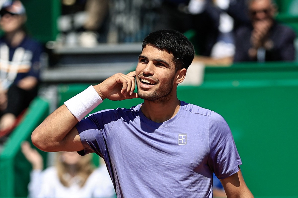 Spain's Carlos Alcaraz reacts after a point as he plays against Germany's Daniel Altmaier during the Monte Carlo ATP Masters Series Tournament round of 16 tennis match on the Ranier III court at the Monte Carlo Country Club in Roquebrune-Cap-Martin on April 10, 2025. (Photo by Valery HACHE / AFP)