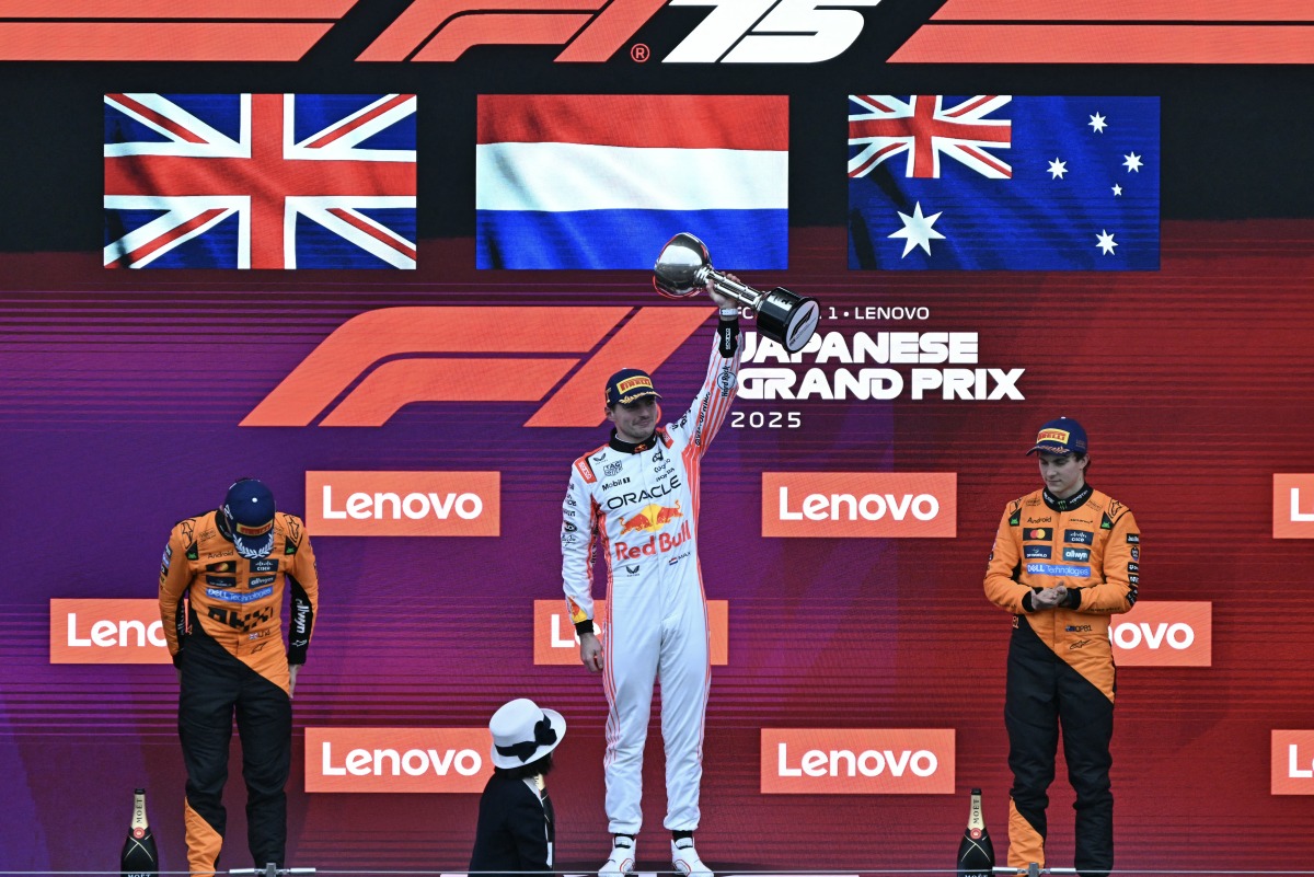 (L-R) Second-placed McLaren's British driver Lando Norris, winner Red Bull Racing's Dutch driver Max Verstappen, and third-placed McLaren's Australian driver Oscar Piastri celebrate on the podium after the Formula One Japanese Grand Prix at the Suzuka circuit in Suzuka, Mie prefecture, Japan on April 6, 2025. Photo by MOHD RASFAN / AFP.