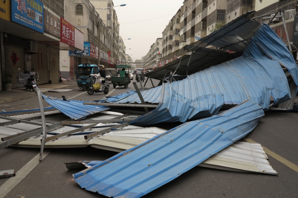 The remains of a metal structure are seen after it was blown over by high winds in Fuyang, in China's eastern Anhui province on April 12, 2025. (Photo by AFP) 
 