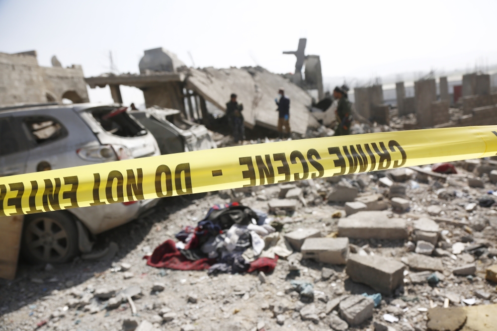 File: Forensic evidence members work at the site of a house destroyed by US airstrikes in Sanaa, Yemen, on April 7, 2025. (Photo by Mohammed Mohammed/Xinhua)

