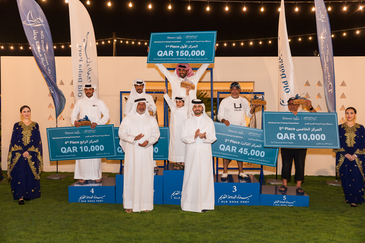CEO of Old Doha Port, Engineer Mohammed Abdullah Al Mulla (right, front) and others with the winners.   