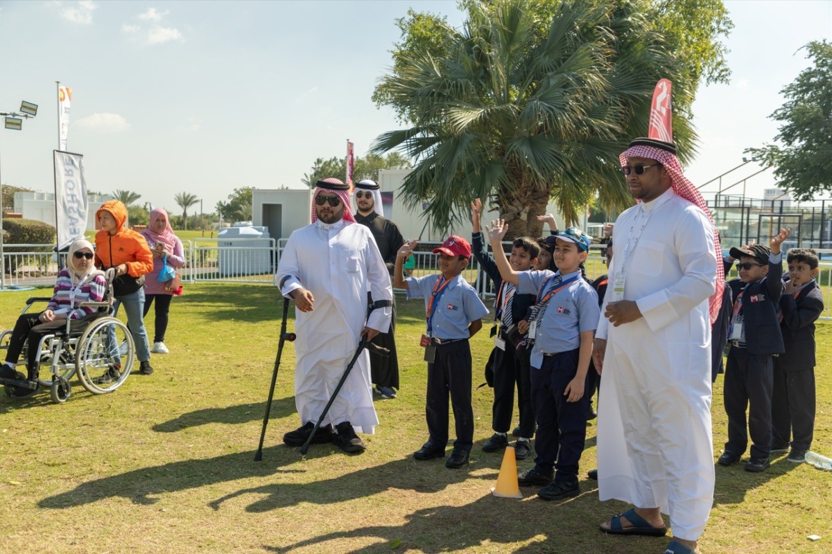 Officials and students at one of the events organised by QCDC.