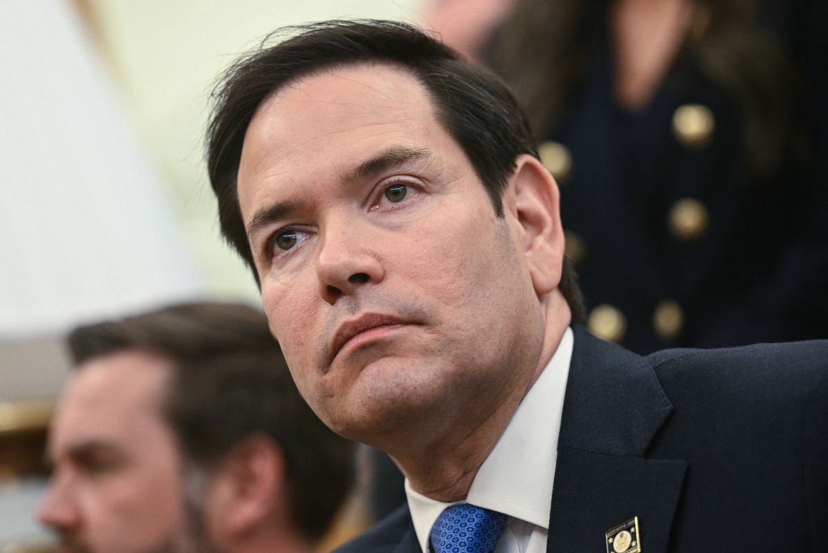 US Secretary of State Marco Rubio listens as President Donald Trump meets with El Salvador's President Nayib Bukele in the Oval Office of the White House in Washington, DC, April 14, 2025. Photo by Brendan SMIALOWSKI / AFP.