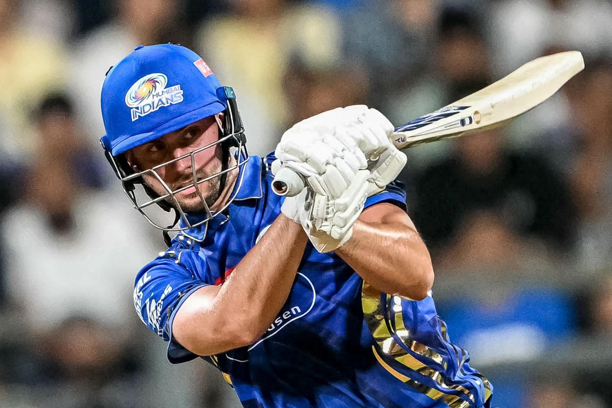 Mumbai Indians' Will Jacks watches the ball after playing a shot during the Indian Premier League (IPL) Twenty20 cricket match between Mumbai Indians and Sunrisers Hyderabad at the Wankhede Stadium in Mumbai on April 17, 2025. (Photo by Punit PARANJPE / AFP)