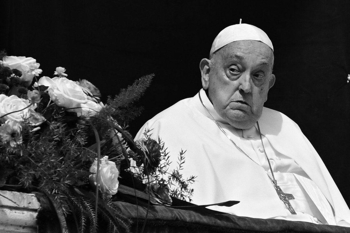 Pope Francis stands on the main balcony of St. Peter's basilica during the Urbi et Orbi message and blessing to the city and the world as part of Easter celebrations, at St Peter's square in the Vatican on April 20, 2025. Photo by Tiziana Fabi / AFP.