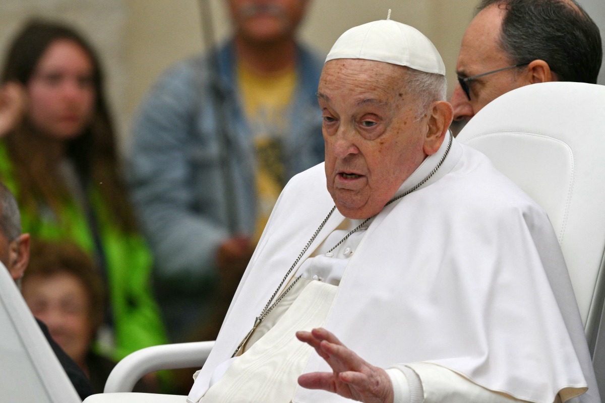 Pope Francis waves to the crowd from the popemobile after the Easter mass, at St Peter's square in the Vatican on April 20, 2025. (Photo by Andreas SOLARO / AFP)