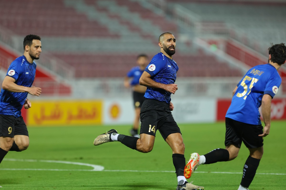 Mohamed Abdula Methnani (centre) celebrates after scoring the winner for Al Sailiya against Muaither.  