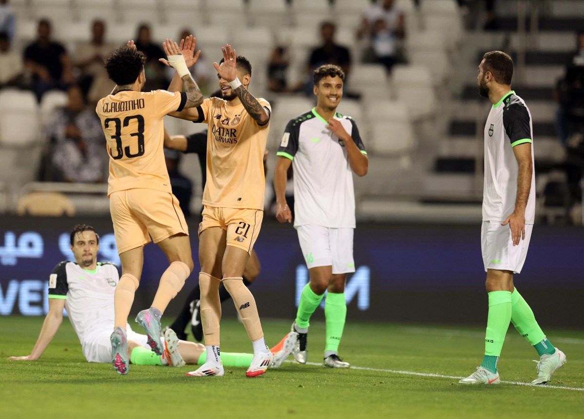 Al Sadd’s Claudinho and Giovani celebrate as Al Ahli’s Matej Mitrovic (left) reacts after scoring an own goal during the first semi-final.