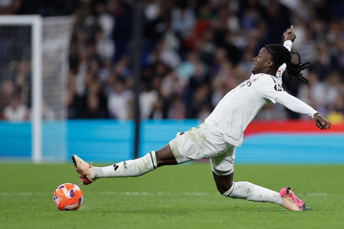 Real Madrid's French midfielder #06 Eduardo Camavinga controls the ball during the Spanish league football match between Real Madrid CF and Athletic Club Bilbao at the Santiago Bernabeu Stadium in Madrid, on April 20, 2025. (Photo by OSCAR DEL POZO / AFP)