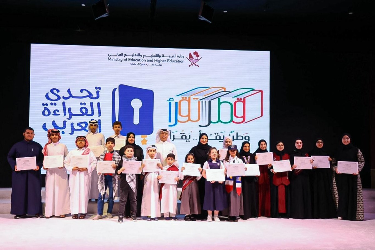 Undersecretary of the MoEHE H E Ibrahim bin Saleh Al Nuaimi pose with students as the Ministry of Education and Higher Education concluded the 6th edition of the Reading Olympiad and the 9th season of the Arab Reading Challenge.