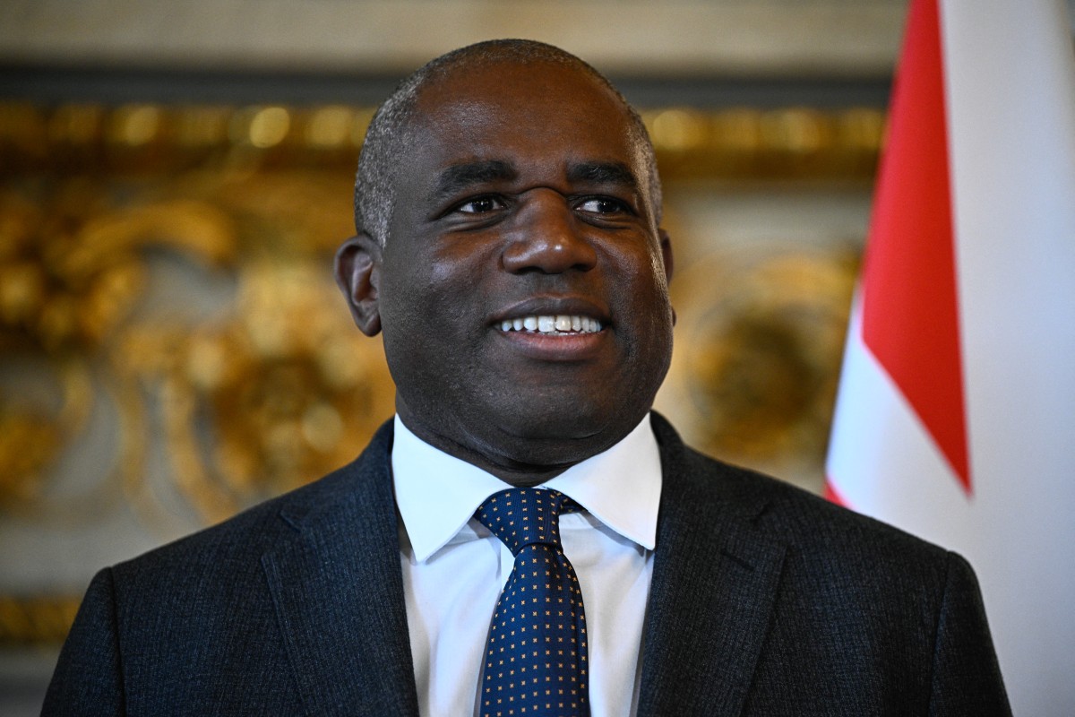 Britain's Foreign Secretary David Lammy poses for photos upon his arrival at the Quai d'Orsay, France's Minister of Foreign Affairs before a bilateral meeting in Paris on April 17, 2025. (Photo by Julien De Rosa / Pool / AFP)
