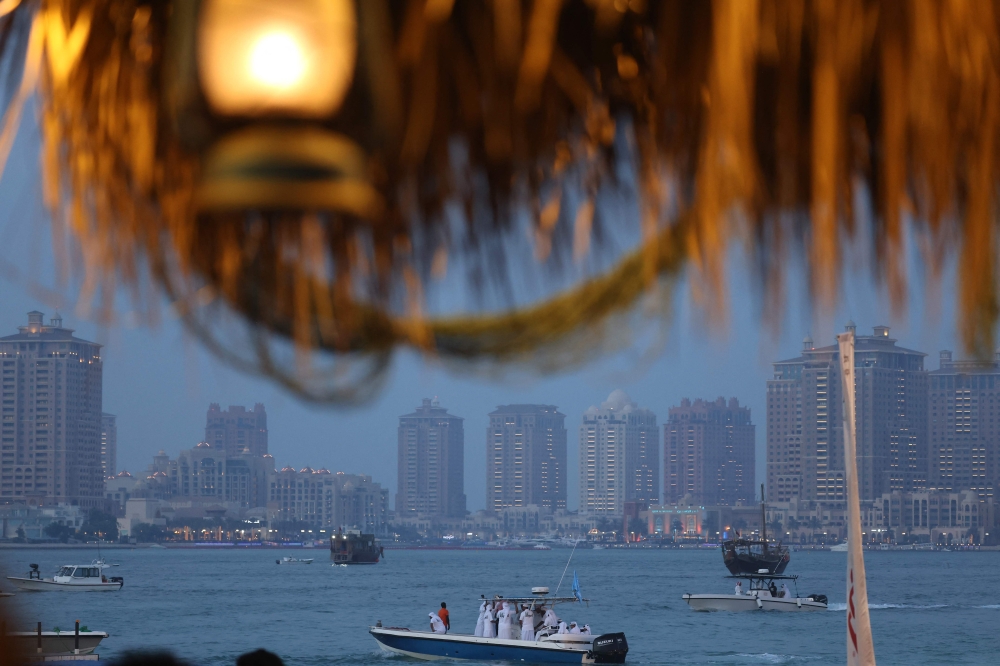 Boats sail in Doha's West Bay waters on April 25, 2025. (Photo by Karim Jaafar / AFP)