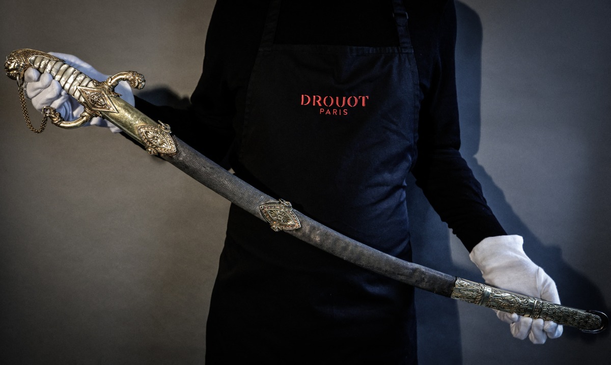 This photograph taken in Paris on April 25, 2025 shows the last sword that belonged to French Emperor Napoleon before its auction on May 22 at Hotel Drouot. (Photo by STEPHANE DE SAKUTIN / AFP)
