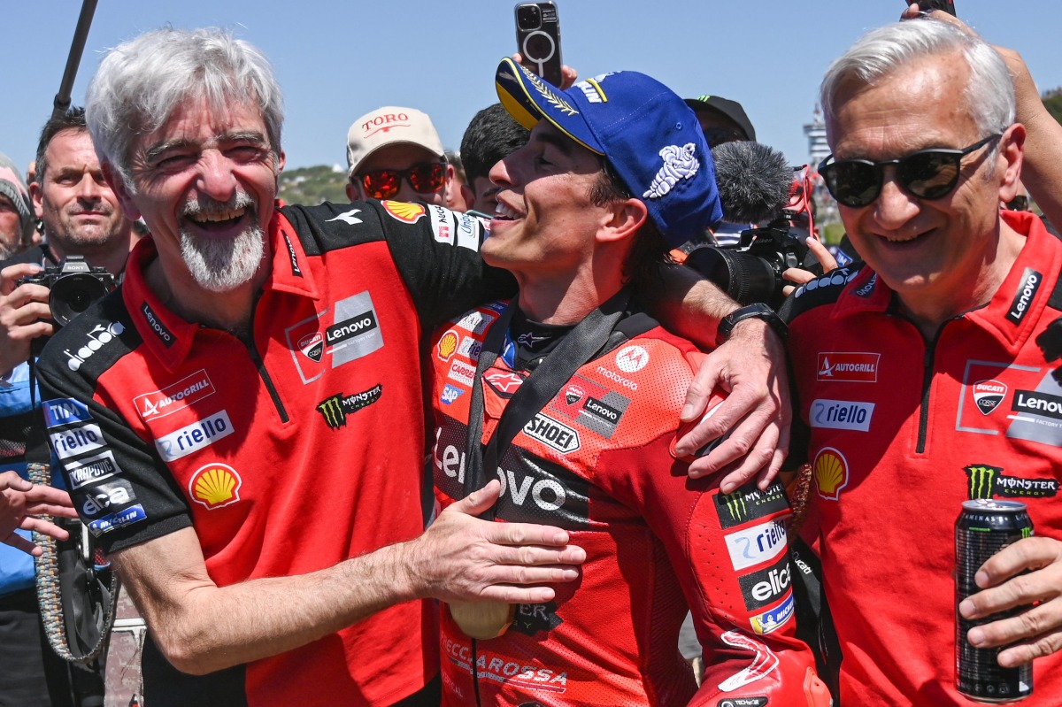 Ducati Lenovo Team's Spanish rider Marc Marquez (C) celebrates after winning the the MotoGP Spanish Grand Prix Sprint race at the Jerez racetrack in Jerez de la Frontera, on April 26, 2025. (Photo by JORGE GUERRERO / AFP)

