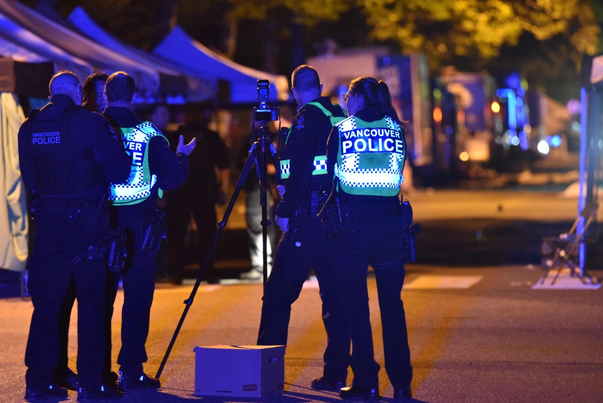 Vancouver police investigate a crime scene after a man drove into pedestrians at the annual Lapu Lapu festival celebrating Filipino culture, at East 43rd Avenue and Fraser, in the south of Vancouver on April 26, 2025. Photo by Don MacKinnon / AFP