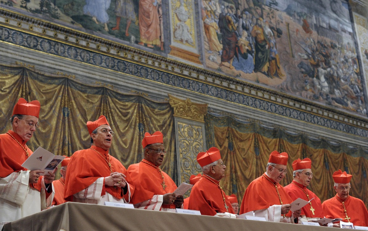 This handout picture released by the Press office shows cardinals chanting the Latin hymn 