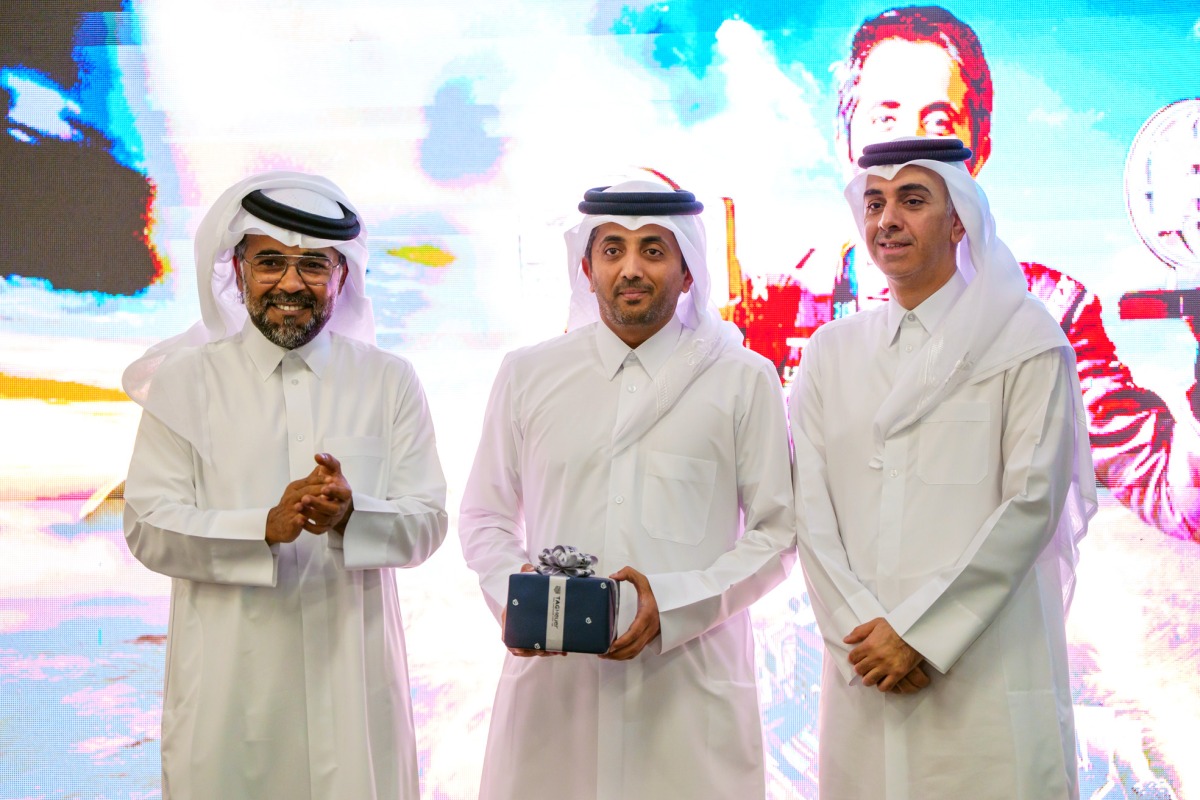 Nasser Al-Kuwari (centre) poses with QMMF and LIC President Abdulrahman bin Abdullatif Al-Mannai (left) and Undersecretary of the Ministry of Sports and Youth Engineer Yasser bin Abdullah Al-Jamal at his felicitation function.