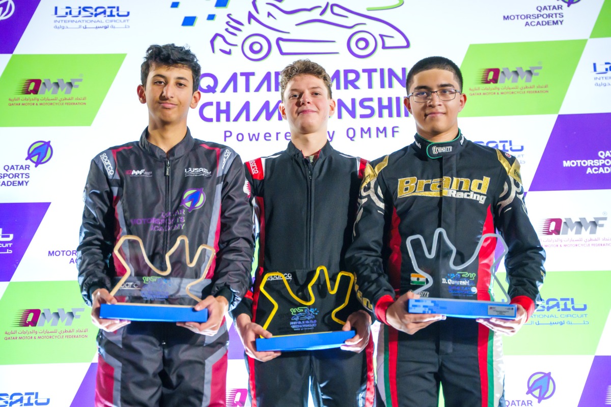 Aleksei Guzov (centre) poses with the trophy along with the podium winners of the opening round.