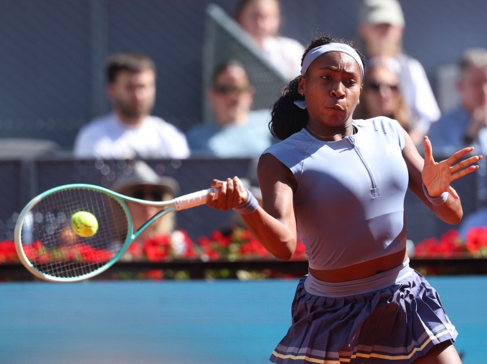 USA's Coco Gauff returns the ball to Poland's Iga Swiatek during their 2025 WTA Tour Madrid Open tennis tournament semi-final singles match at the Caja Magica in Madrid, on May 1, 2025. (Photo by Pierre-Philippe Marcou / AFP)