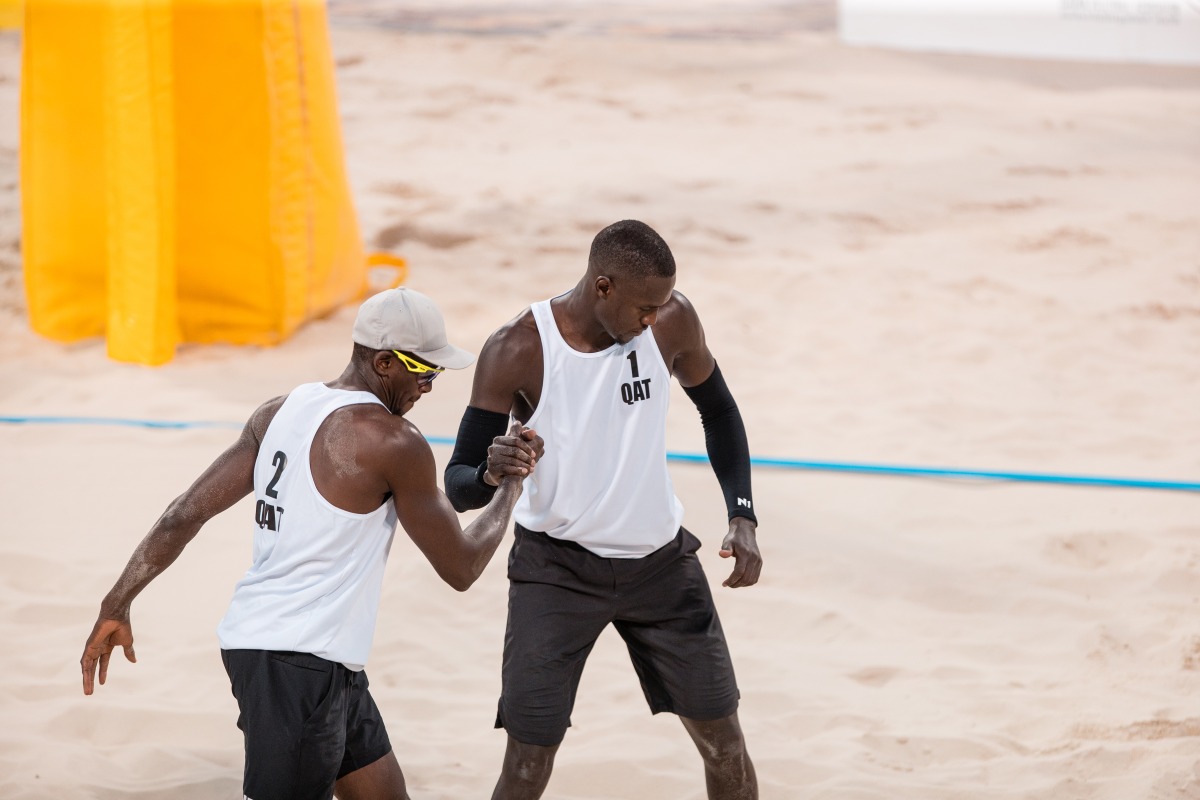 Qatar’s Ahmed Tijan (left) and Cherif Younousse celebrate.