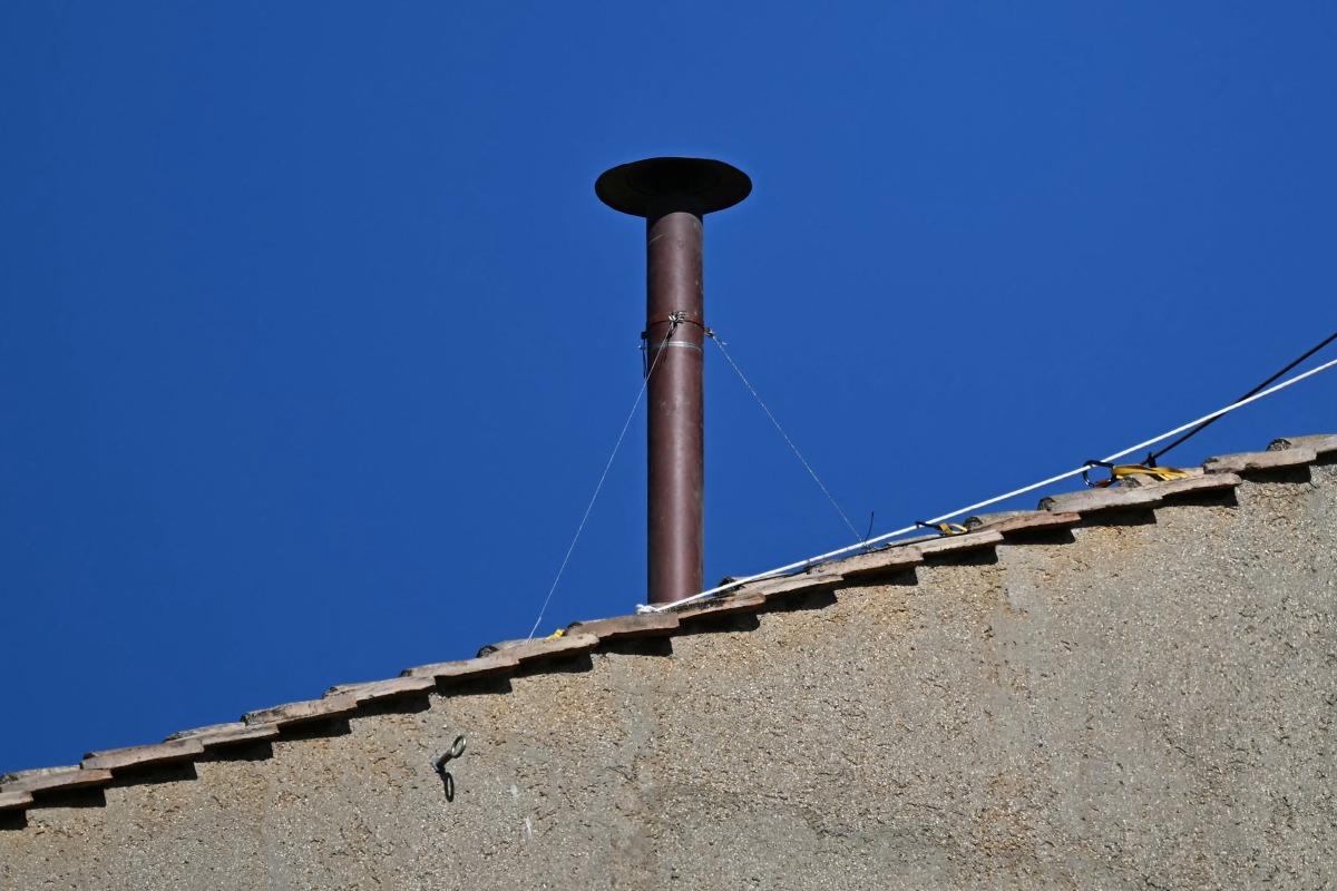 This photograph shows a view of the chimney on the roof of the Sistine Chapel as it is being installed in The Vatican, on May 2, 2025. Photo by Gabriel BOUYS / AFP
