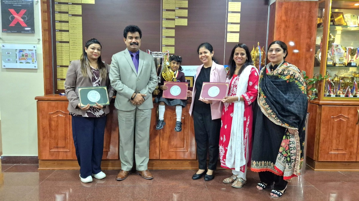 BPS student Dhvani Tejaswi with school staff and teachers.