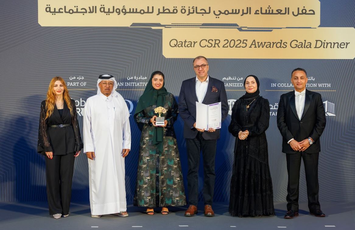 Officials pose for a group photo during the Qatar CSR Awards 2025 held at The Ritz-Carlton.