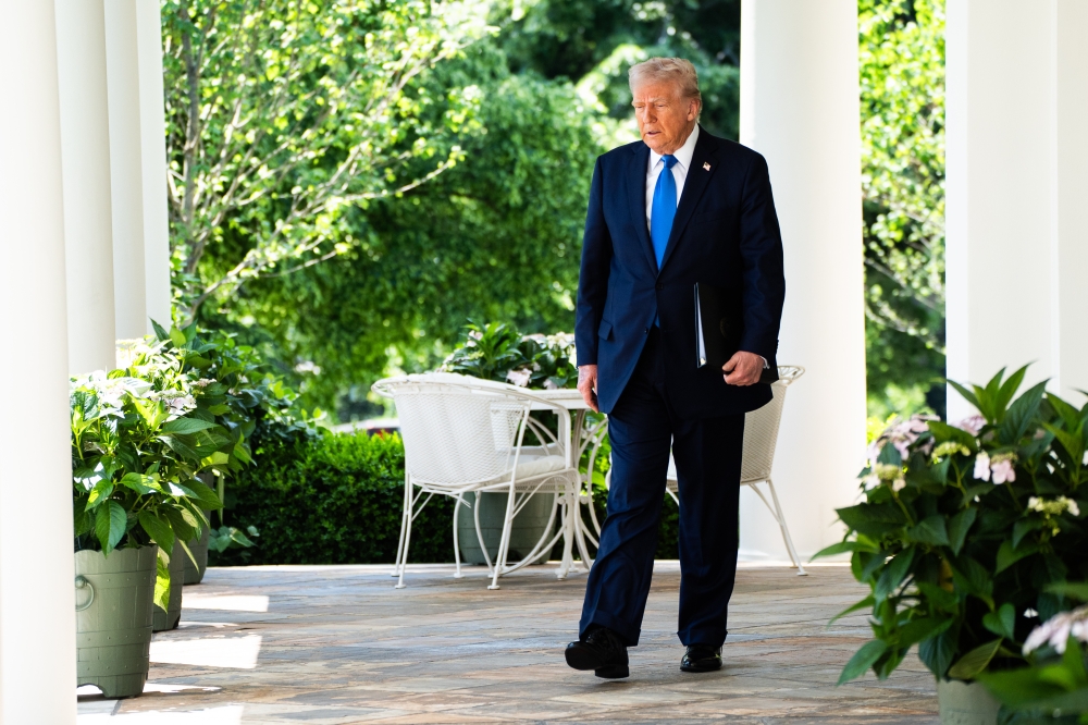 President Donald Trump exits the Oval Office for an event for the National Day of Prayer in the Rose Garden on Thursday. MUST CREDIT: Demetrius Freeman/The Washington Post