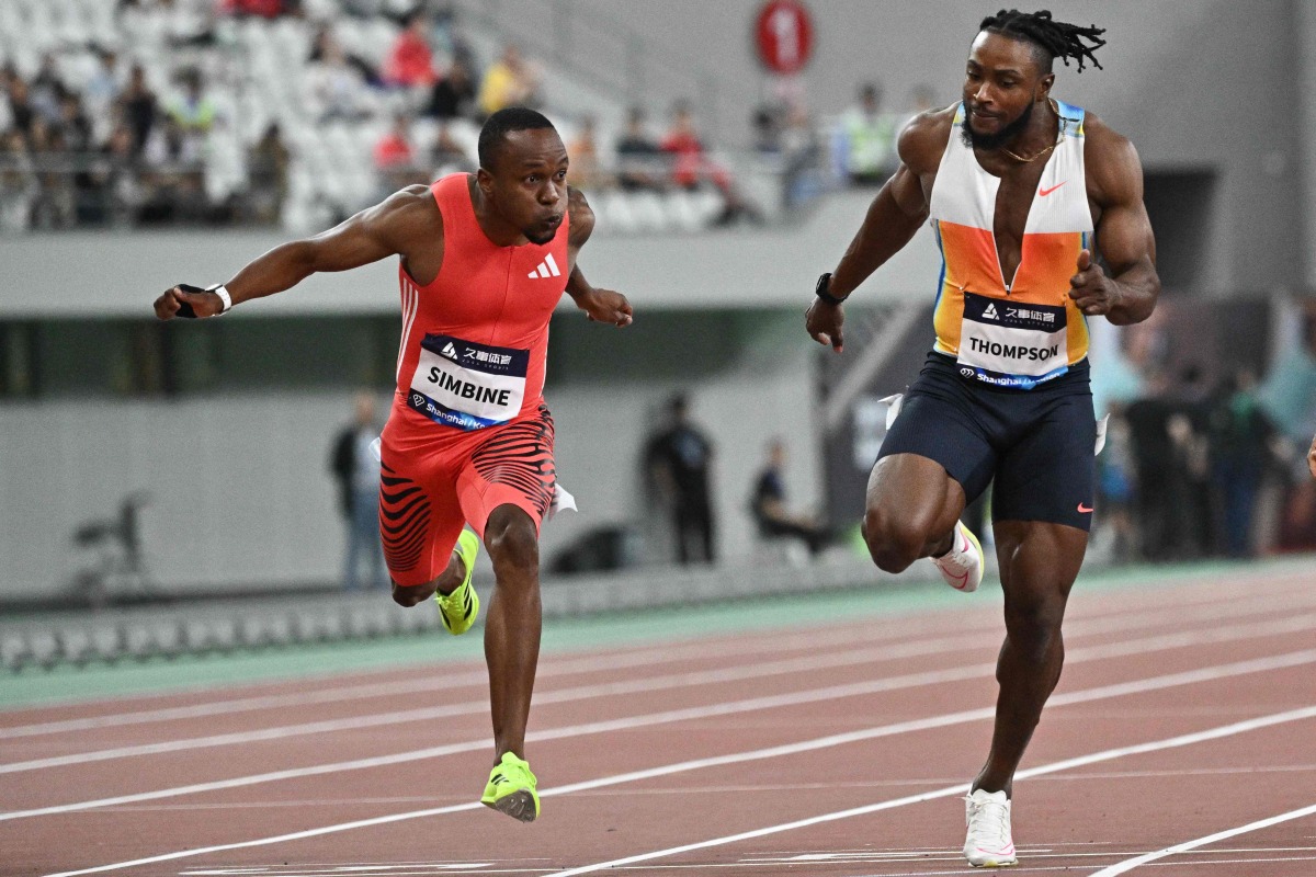 South Africa’s Akani Simbine (left) and Jamaica’s Kishane Thompson compete in men’s 100m yesterday. 