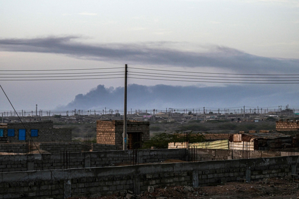 Smoke rises from the airport of Port Sudan following reported attacks early on May 4, 2025. (Photo by AFP)

