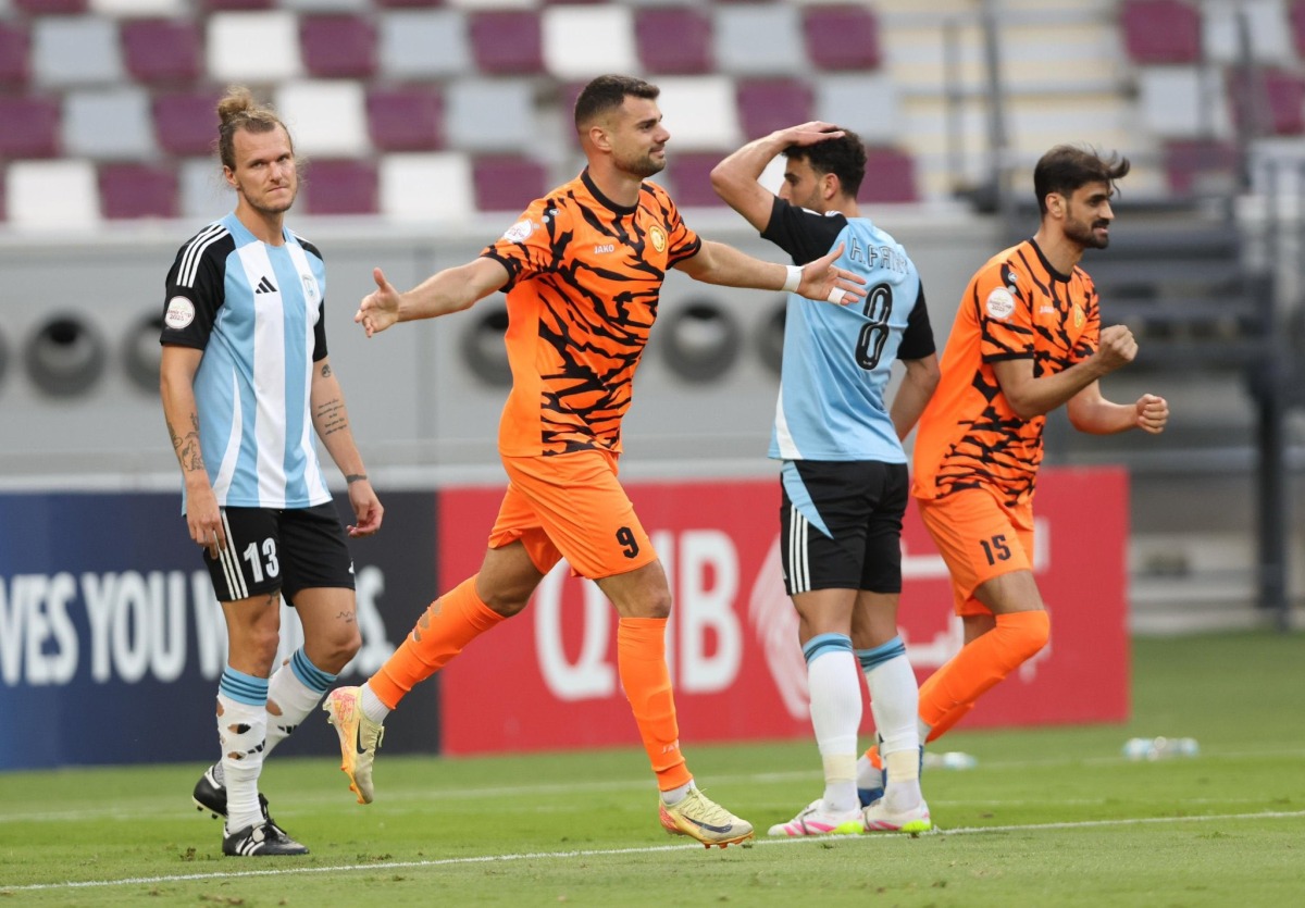 Umm Salal's Antonio Mance (centre) celebrates after scoring against Al Wakrah yesterday. 
