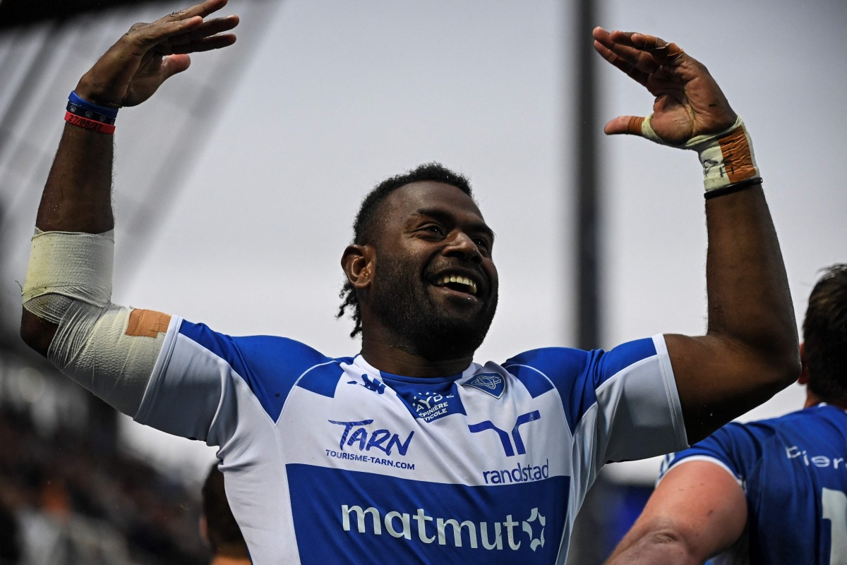 Castres' Fiji wing Josaia Raisuqe celebrates after scoring a try during the French Top14 rugby union match between Castres Olympique and Rugby Club Toulonnais (Toulon) at The Pierre-Fabre Stadium in Castres, south-western France, on April 22, 2023. Photo by Valentine CHAPUIS / AFP