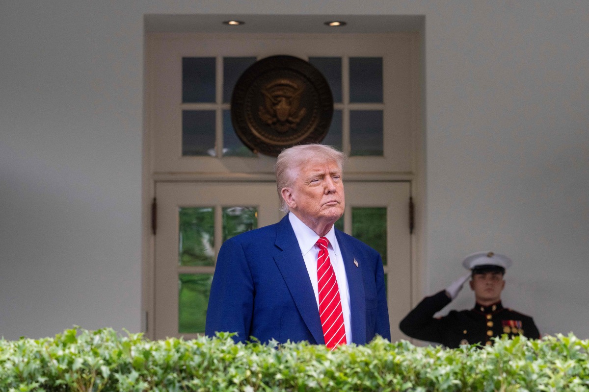 US President Donald Trump takes questions outside the West Wing of White House in Washington, DC, on May 8, 2025. (Photo by Jim WATSON / AFP)
