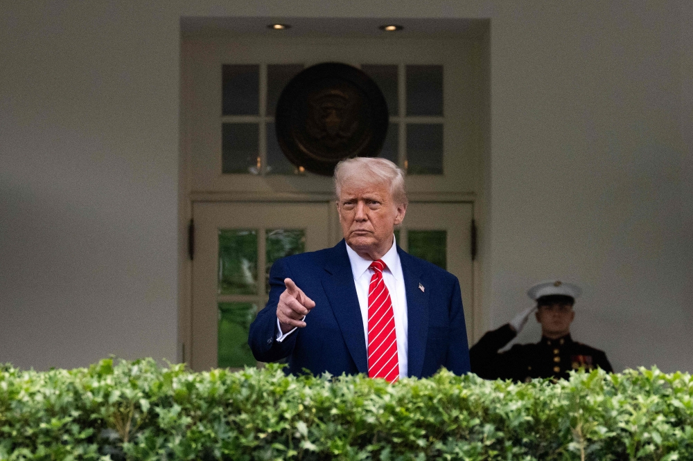 US President Donald Trump takes questions outside the West Wing of White House in Washington, DC, on May 8, 2025. (Photo by Jim Watson / AFP)