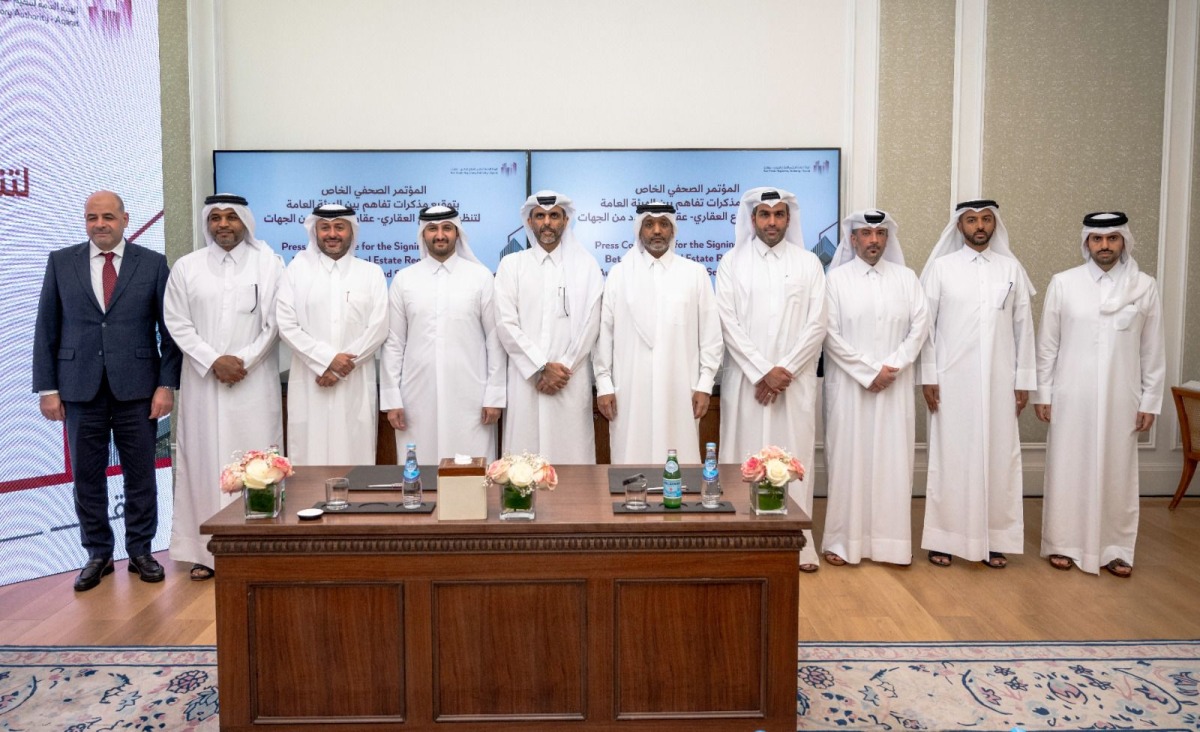 Aqarat Chairman Eng. Khalid bin Ahmed Al-Obaidli with other officials during the signing ceremony.
