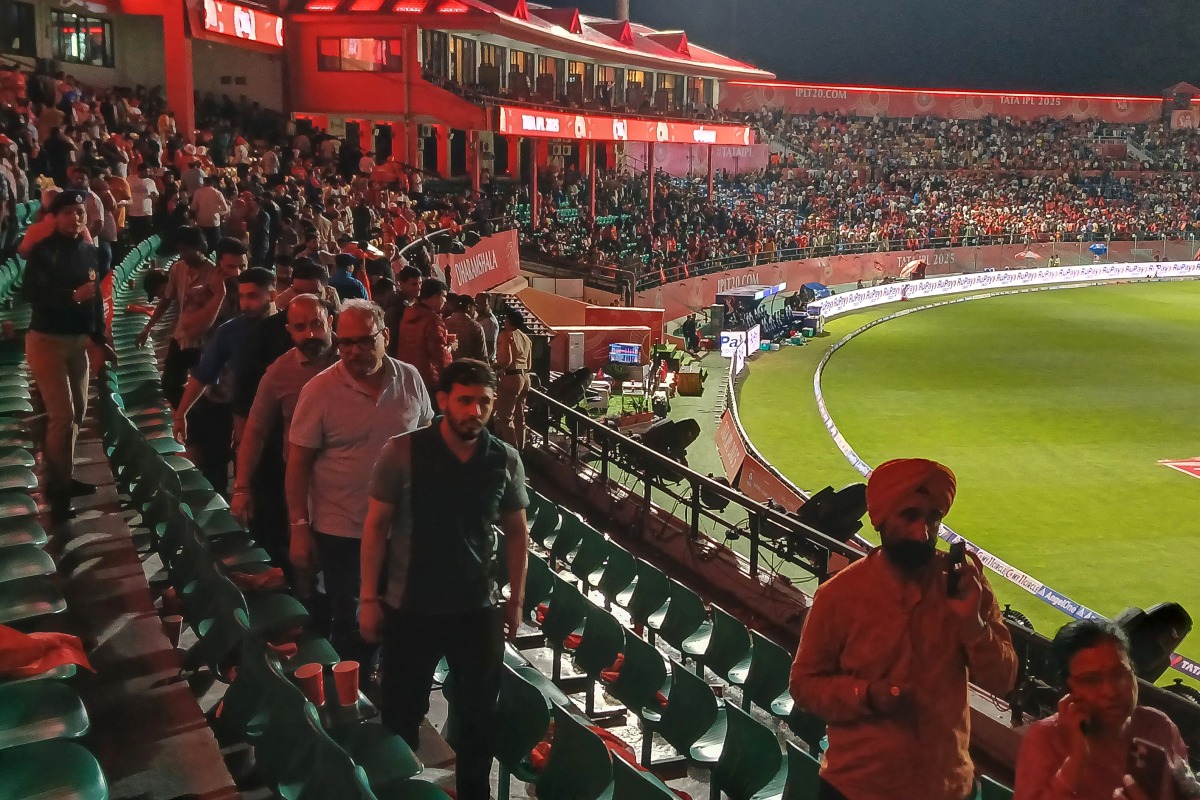 Photo used for representational purposes. Spectators leave after the Indian Premier League (IPL) Twenty20 cricket match between Punjab Kings and Delhi Capitals was abandoned due to a significant technical failure at the Himachal Pradesh Cricket Association Stadium in Dharamsala on May 8, 2025. (Photo by Shammi MEHRA / AFP) 