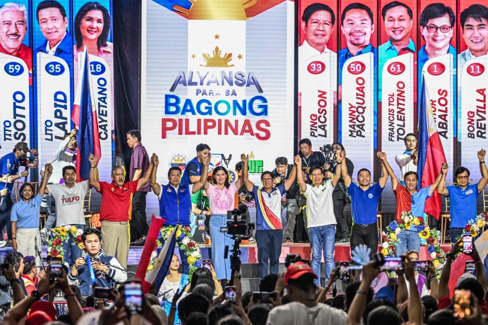 Philippines' President Ferdinand Marcos Jr (C) attends a campaign rally of senatorial candidates under his party in Mandaluyong, Metro Manila, on May 9, 2025, ahead of the midterm elections. (Photo by Jam Sta Rosa / AFP)