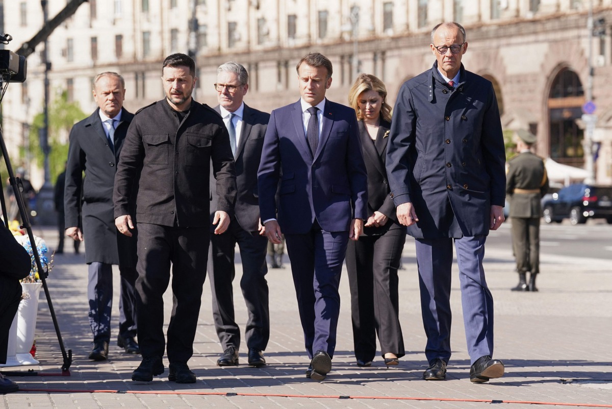(From L) Poland's Prime Minister Donald Tusk, Ukraine's President Volodymyr Zelensky, Britain's Prime Minister Keir Starmer, France's President Emmanuel Macron, Olena Zelenska and Germany's Chancellor Friedrich Merz (Photo by Stefan Rousseau / POOL / AFP)