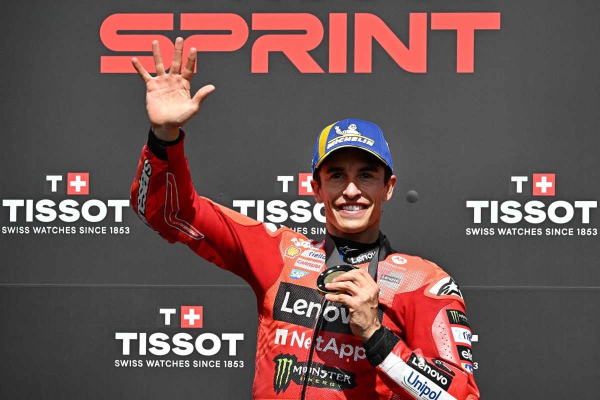 Ducati Lenovo Team's Spanish MotoGP rider Marc Marquez poses after winning the sprint race, as part of the France Moto GP Grand Prix, at Le Mans Circuit on May 10, 2025. (Photo by LOIC VENANCE / AFP)