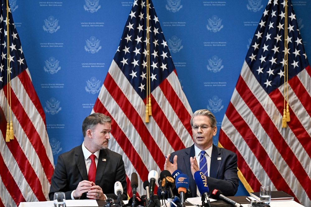 US Treasury Secretary Scott Bessent (R) and US Trade Representative Jamieson Greer hold a news conference in Geneve on May 12, 2025. (Photo by Fabrice Coffrini / AFP)