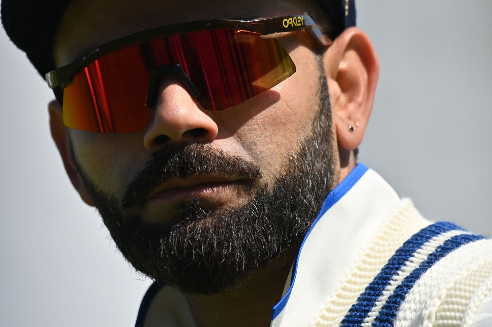 (Files) India's Virat Kohli reacts ahead of play on day 2 of the ICC World Test Championship cricket final match between Australia and India at The Oval, in London, on June 8, 2023. (Photo by Glyn Kirk / AFP) 