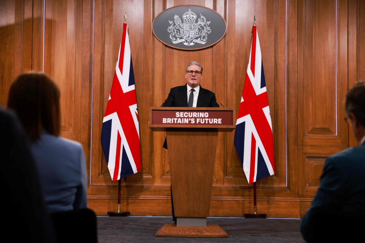 Britain's Prime Minister Keir Starmer delivers a speech during a press conference at the media briefing room of 9 Downing Street, central London, on May 12, 2025 ahead of the publication of the Government's Immigration White Paper. (Photo by Ian Vogler / POOL / AFP)
