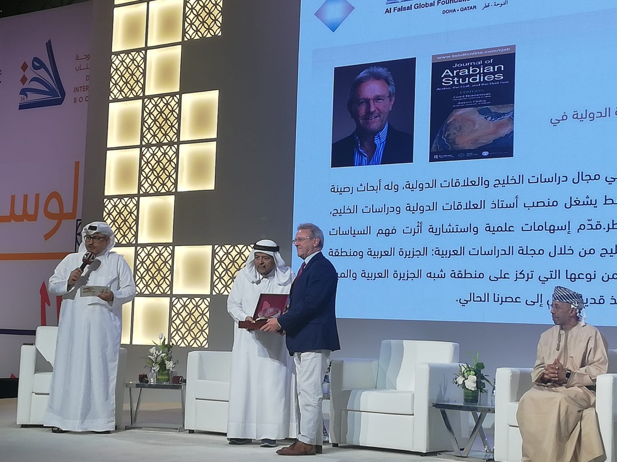 H E Sheikh Faisal bin Qassim Al Thani presenting the award to GU-Q's Dr. Gerd Nonneman at Doha International Book Fair.